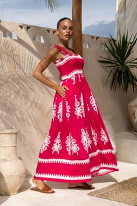 Detail of rose red tropical floral maxi dress with ruffle straps and cotton linen texture