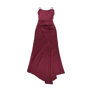 Detail of burgundy satin dress showing the side slit, waist pleats, and glossy fabric texture