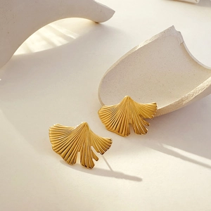 Close-up of 18K gold-plated ginkgo leaf earrings with detailed leaf vein textures