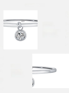 Macro detail of S925 sterling silver ring with D color VVS1 moissanite pendant charm