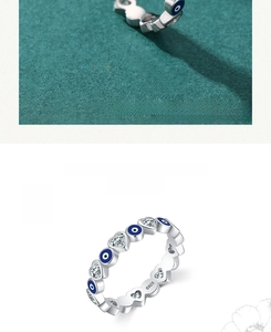 Macro shot of S925 sterling silver ring with blue evil eye and heart cubic zirconia
