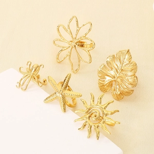 Golden stainless steel ring set featuring starfish flower and sea life designs