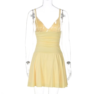 Detailed back view of yellow pleated mini dress showing sleek spaghetti straps and ruffle hem