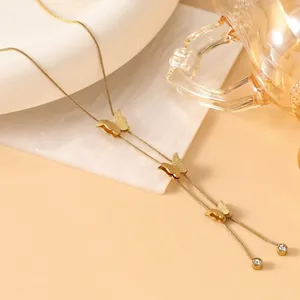 Elegant 18K gold plated Y-shaped necklace featuring matte butterfly charms and crystals