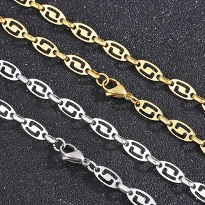 Close-up of gold and silver stainless steel oval link chains with lobster clasps