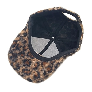 Detail view of leopard print faux teddy fleece baseball cap with adjustable back strap