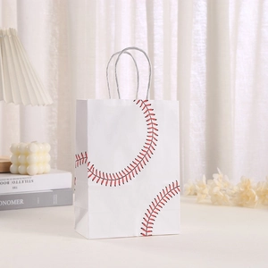 Detailed view of white baseball gift paper bag with red stitching in a cozy lifestyle setting