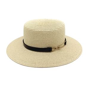 Chic beige flat-top straw hat with a black leather band and golden buckle for summer