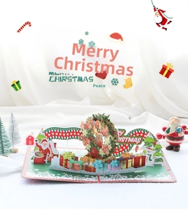 Macro view of 3D pop-up Christmas card featuring a laser-cut festive wreath and Santa Claus