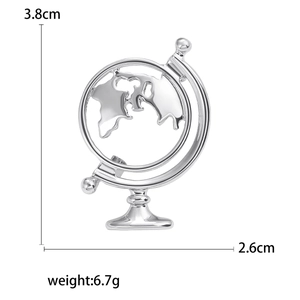 Detail view of silver globe brooch with size 3.8x2.6cm and weight 6.7g on white background