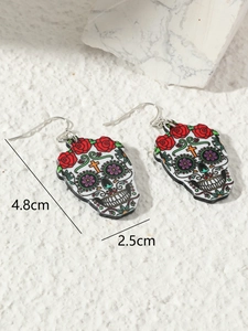 Macro detail of Sugar Skull earrings with rose floral patterns and 4.8cm height dimension