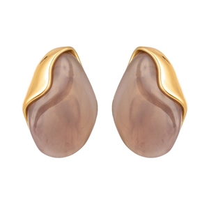 Macro view of teardrop grey resin earrings with polished gold-plated metal accents