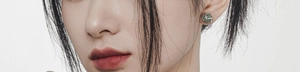 Close-up of a model wearing a S925 silver earring set with an irregular green aventurine stone