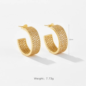 Macro shot of 22mm gold C-hoop earrings with micro-pave stones and S925 hallmark