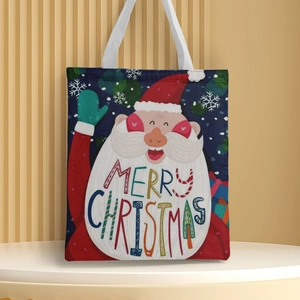 Detailed view of canvas tote bag featuring a Santa Claus print and Merry Christmas text