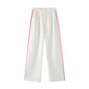 Detail of high-waisted white wide-leg trousers featuring contrasting pink side stripes