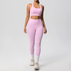 Detailed shot of pink yoga set showing high-waist leggings with practical side pocket