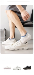 Men's low-cut invisible white socks paired with canvas shoes and sneakers detail