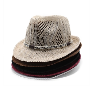 Detail of five assorted summer knitted fedora hats showing hollow weave and texture