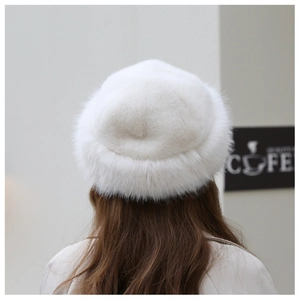 Rear view of a fluffy white faux fur winter beanie hat with warm and soft texture