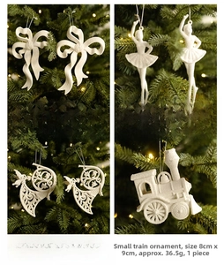 White frosted Christmas ornaments set featuring ribbon bow, ballerina, horn and train