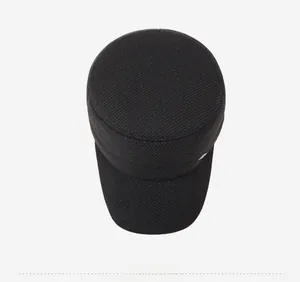 Top down view of black flat top cadet hat with minimalist silver metal button detail