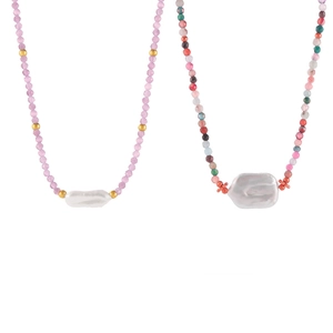 Baroque style necklace featuring colorful natural stones and large baroque pearls on gold chain