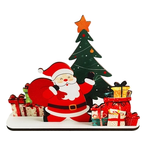 Detail of wooden Santa Claus and Christmas tree tabletop ornament with gift boxes