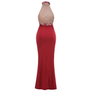 Detail of red halter dress featuring floral embroidery and backless mesh patchwork