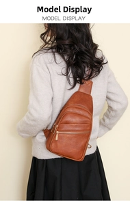 Macro view of brown PU leather chest bag with retro geometric strap and gold zippers