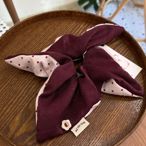 Vintage pink polka dot and burgundy patchwork scrunchie with a small floral button detail