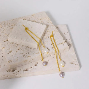 Elegant gold tassel earrings with natural white and lavender baroque pearls on stone base