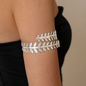 Detailed close-up of a silver olive leaf armlet featuring an adjustable spiral metal design