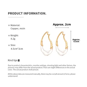 Detailed view of teardrop resin earrings with copper frame dimensions and weight info