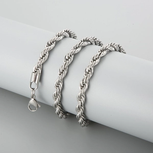 Macro shot of silver stainless steel twisted chain necklace with a lobster clasp closure
