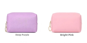 Detail of waterproof PU cosmetic bags in deep purple and hot pink with gold metal zippers