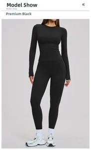 Slim fit black yoga set featuring high waist leggings and long sleeve sports top