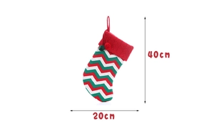 Detail view of a knitted Christmas stocking with 40x20cm size dimensions shown