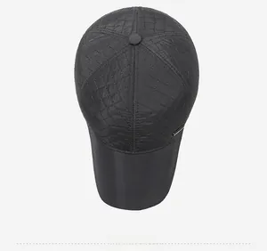 Top down view of a men's winter hat featuring quilted diamond pattern and fleece lining