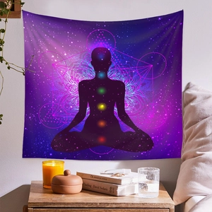 Detail of meditation tapestry with purple galaxy theme and seven chakra symbols on wall