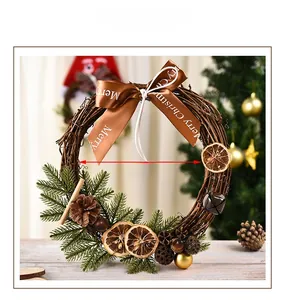 Detail of 27cm Christmas wreath featuring pine cones, cinnamon sticks, and dried orange slices