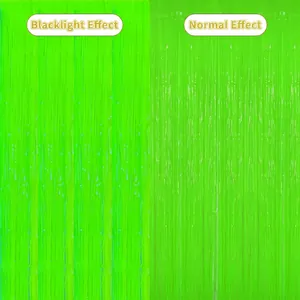 Neon green tinsel curtain showing contrast between UV glow and normal light effects
