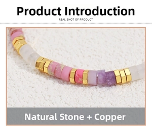 Detail of natural colorful stone beads with golden copper hexagon spacers on necklace
