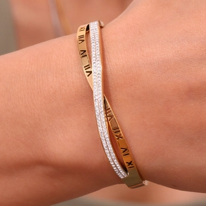 18K gold plated stainless steel crossover bracelet with micro-pave crystals and Roman numerals