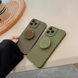 Detail view of military green and olive matte silicone phone cases with pop sockets