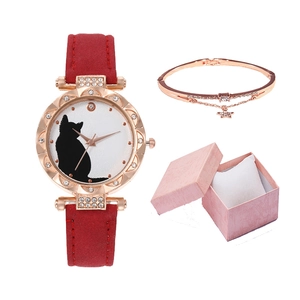 Women's cat dial watch with red strap and rose gold star bracelet in a pink gift box