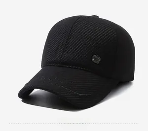 Detail view of black winter baseball cap featuring textured fabric and star metal badge
