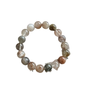 Natural rutilated quartz beaded bracelet with colorful healing stones in a minimalist style