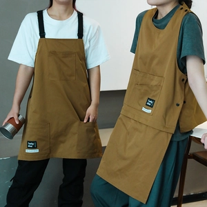Brown canvas work aprons with multiple pockets for baristas and professional kitchens