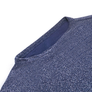 Detailed view of dark blue glitter knit fabric texture and high-quality neckline stitching
